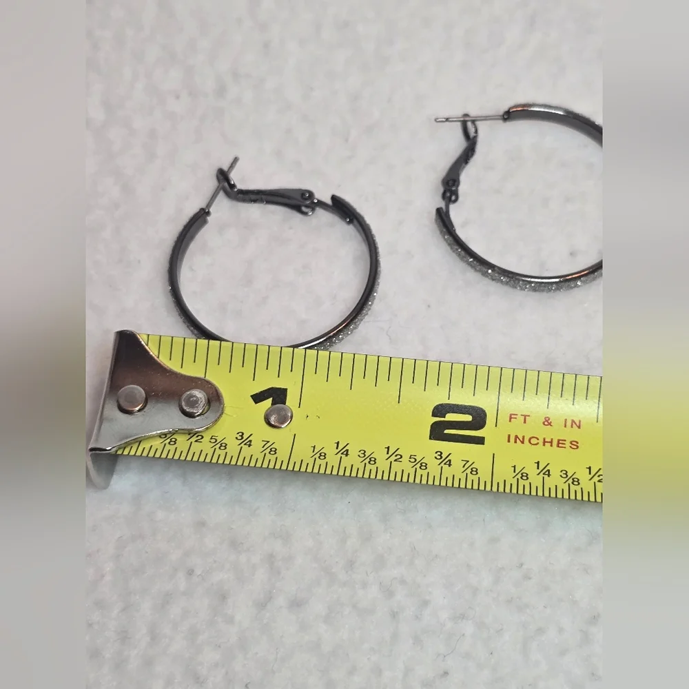 Black hoop earrings with sparkly rhinestones